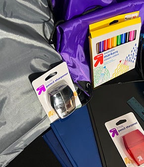 Back-to-school supplies — markers, pencil sharpeners, and school materials